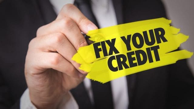 fix your credit written in marker on board